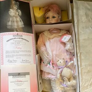 Pink and White Porcelain Doll with Teddy Bear
